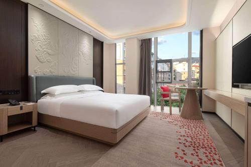 Imagen de la habitación del Hotel Ramada by Wyndham Honghe Kaiyuan. Foto 17