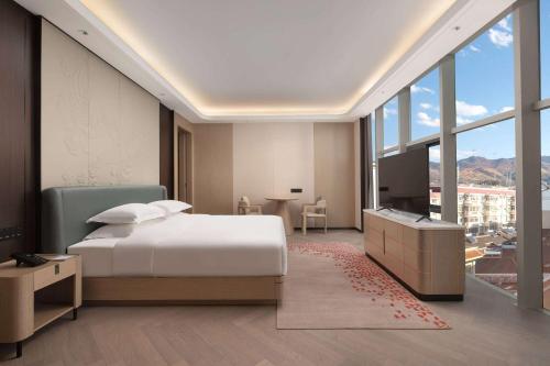 Imagen de la habitación del Hotel Ramada by Wyndham Honghe Kaiyuan. Foto 19