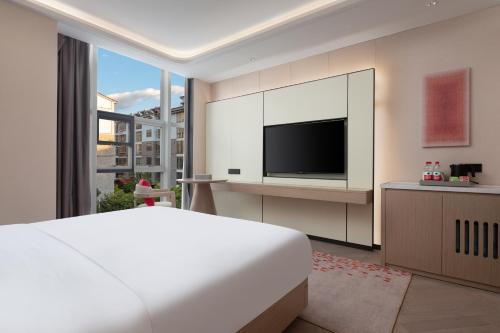 Imagen general del Hotel Ramada by Wyndham Honghe Kaiyuan. Foto 13