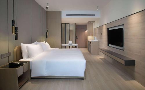 Imagen de la habitación del Hotel Ramada by Wyndham Huizhou Double Moon Bay. Foto 14
