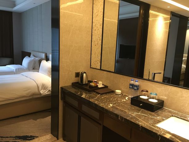 Imagen de la habitación del Hotel Ramada by Wyndham Huizhou South. Foto 11