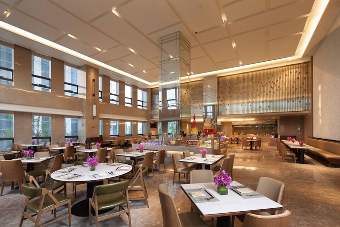 Imagen del bar/restaurante del Hotel Ramada by Wyndham Jinan. Foto 5