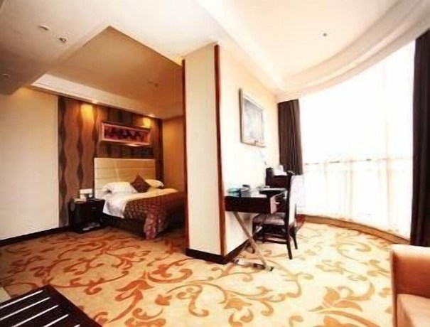 Imagen de la habitación del Hotel Ramada by Wyndham Linyi North. Foto 15
