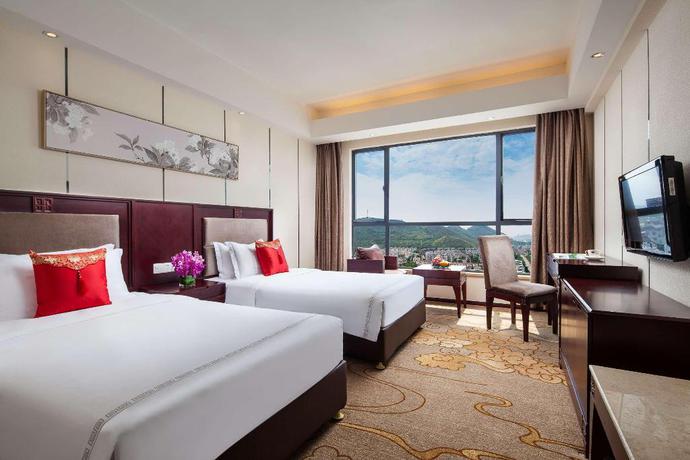 Imagen de la habitación del Hotel Ramada by Wyndham Liuzhou Luzhai. Foto 2