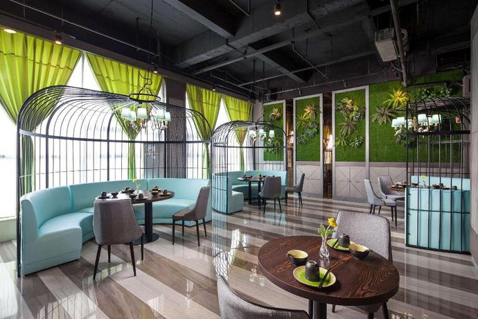 Imagen del bar/restaurante del Hotel Ramada by Wyndham Liuzhou Luzhai. Foto 1