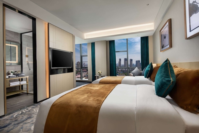 Imagen de la habitación del Hotel Ramada by Wyndham Luoyang Downtown. Foto 5