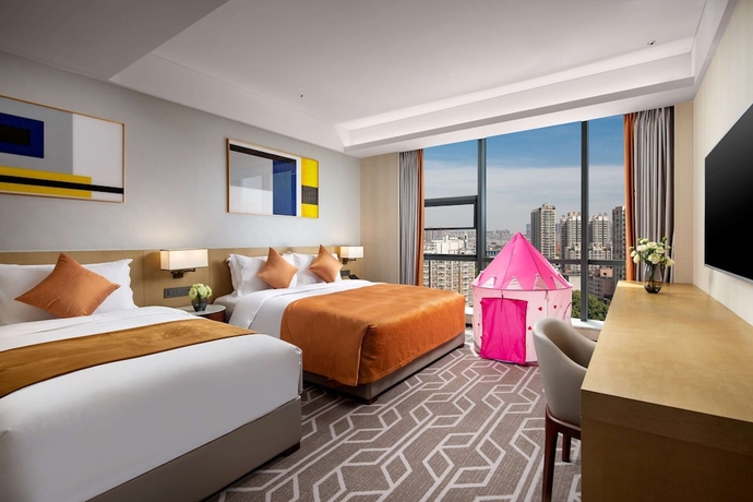 Imagen de la habitación del Hotel Ramada by Wyndham Luoyang Downtown. Foto 7