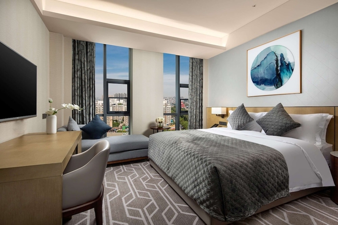 Imagen de la habitación del Hotel Ramada by Wyndham Luoyang Downtown. Foto 11