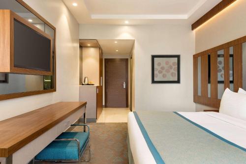 Imagen de la habitación del Hotel Ramada by Wyndham Makkah Zad Al Tayseer. Foto 11