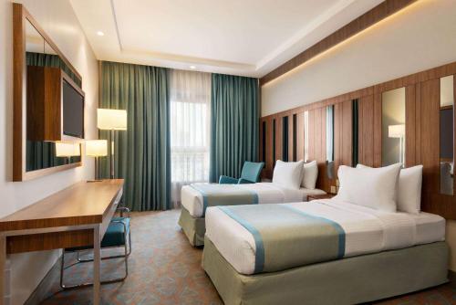 Imagen de la habitación del Hotel Ramada by Wyndham Makkah Zad Al Tayseer. Foto 14