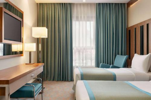 Imagen de la habitación del Hotel Ramada by Wyndham Makkah Zad Al Tayseer. Foto 17