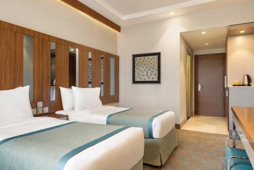 Imagen de la habitación del Hotel Ramada by Wyndham Makkah Zad Al Tayseer. Foto 20
