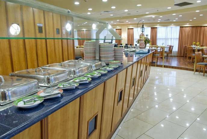 Imagen del bar/restaurante del Hotel Ramada by Wyndham Ramat Gan. Foto 3