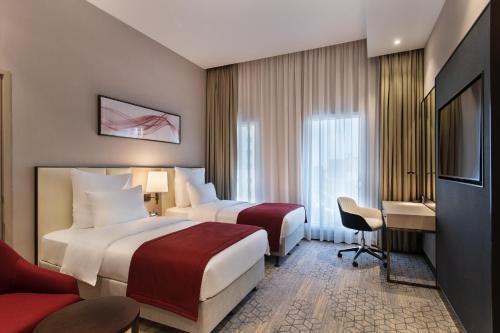 Imagen de la habitación del Hotel Ramada by Wyndham Riyadh King Fahd Road. Foto 8