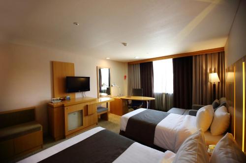 Imagen de la habitación del Hotel Ramada by Wyndham Songdo. Foto 17