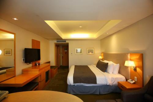 Imagen de la habitación del Hotel Ramada by Wyndham Songdo. Foto 18