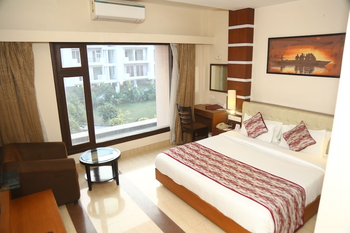 Imagen de la habitación del Hotel Ramada by Wyndham Varanasi Katesar. Foto 9