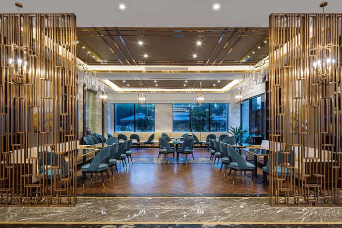 Imagen del bar/restaurante del Hotel Ramada by Wyndham Wuhan Qingshan. Foto 6
