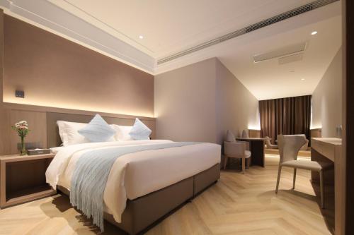 Imagen de la habitación del Hotel Ramada by Wyndham Wuhan Wangjiawan. Foto 4
