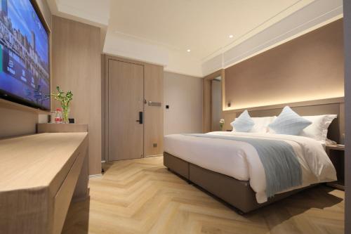 Imagen de la habitación del Hotel Ramada by Wyndham Wuhan Wangjiawan. Foto 6