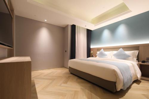 Imagen de la habitación del Hotel Ramada by Wyndham Wuhan Wangjiawan. Foto 9