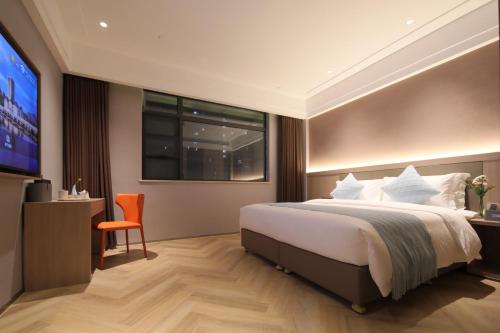 Imagen de la habitación del Hotel Ramada by Wyndham Wuhan Wangjiawan. Foto 12