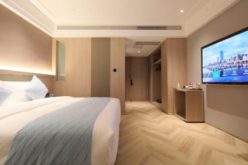 Imagen de la habitación del Hotel Ramada by Wyndham Wuhan Wangjiawan. Foto 14