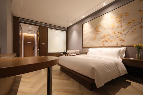 Imagen de la habitación del Hotel Ramada by Wyndham Wuhan Wangjiawan. Foto 16
