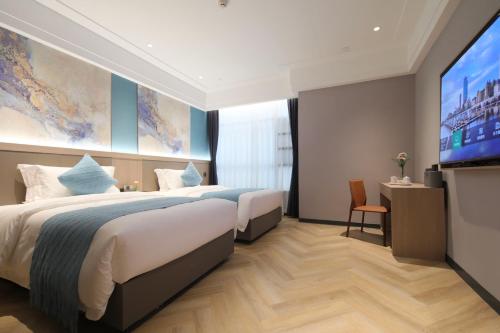 Imagen de la habitación del Hotel Ramada by Wyndham Wuhan Wangjiawan. Foto 18