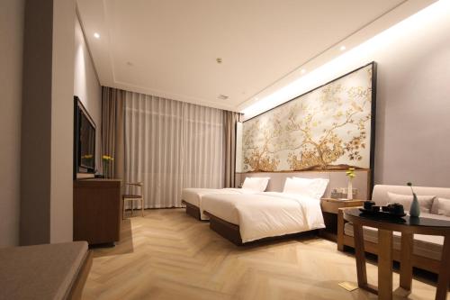 Imagen de la habitación del Hotel Ramada by Wyndham Wuhan Wangjiawan. Foto 20
