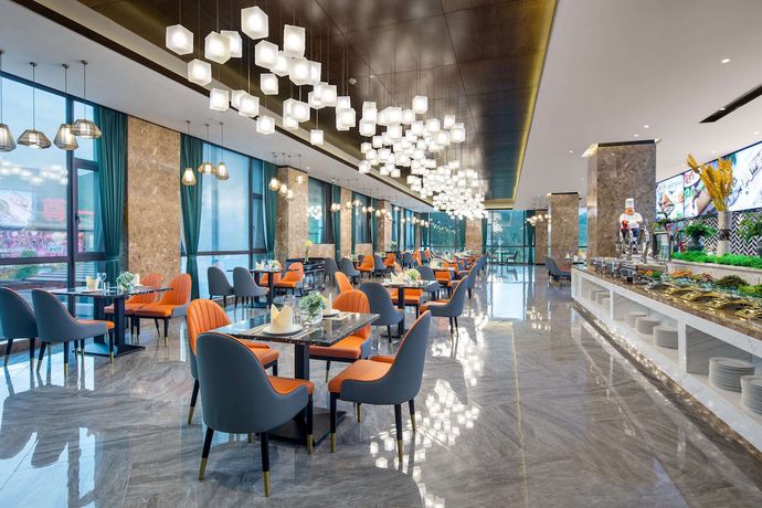 Imagen del bar/restaurante del Hotel Ramada by Wyndham Yingshan Jiulongwan Resort. Foto 3