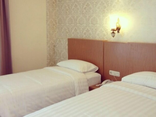 Imagen de la habitación del Hotel Ramayana Hotel. Foto 22
