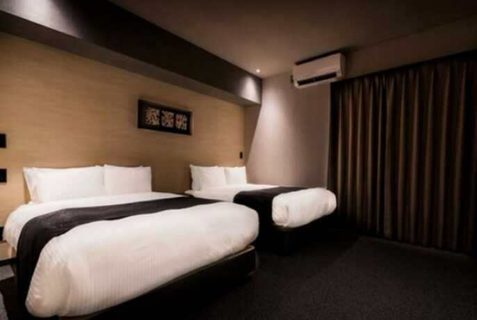 Imagen de la habitación del Hotel Randor Namba Osaka Suites. Foto 11