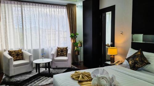 Imagen de la habitación del Hotel Rasamala. Foto 18