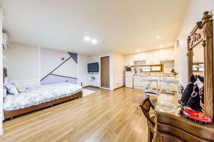 Imagen de la habitación del Hotel Ravie Pension. Foto 13