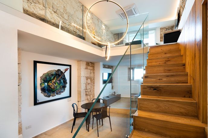 Imagen de la habitación del Hotel Re Dionisio Luxury Suites. Foto 7