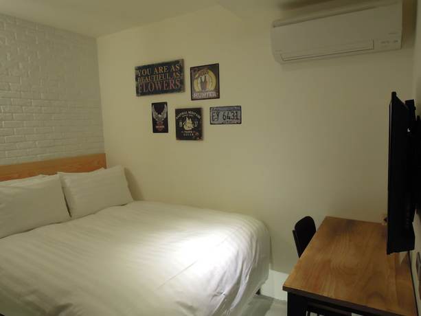 Imagen de la habitación del Hotel Re-Change Hotel Taipei. Foto 17