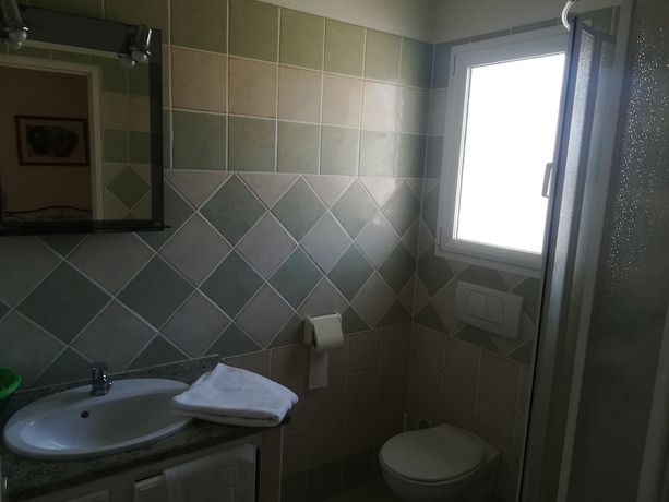Imagen de la habitación del Hotel R&eacute;sidence Marina Di A Testa. Foto 9