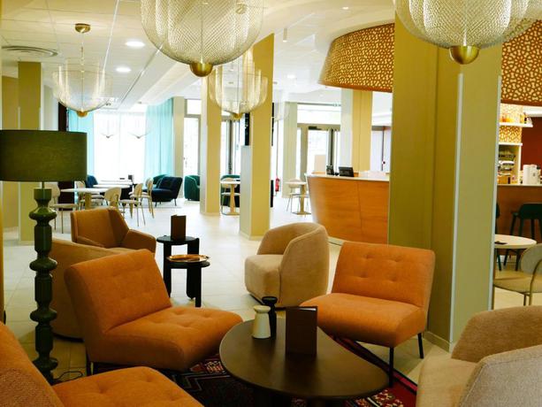 Imagen del bar/restaurante del Hotel R&eacute;sidence les D&ocirc;mes par Vy Resort Thermal & Spa. Foto 2