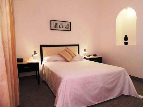 Imagen de la habitación del Hotel Real Home. Foto 6