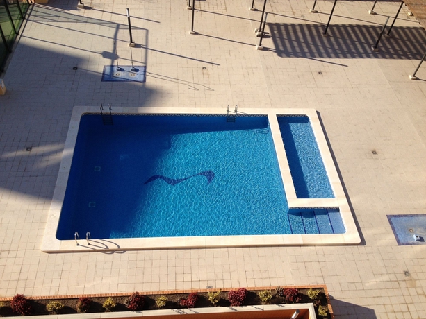 Imagen de la piscina del Hotel Realrent Pobla Marina. Foto 16