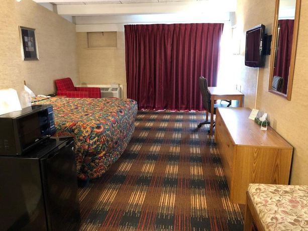 Imagen de la habitación del Hotel Red Carpet Inn North Syracuse. Foto 11