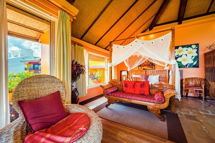 Imagen de la habitación del Hotel Red Garden Resort. Foto 6