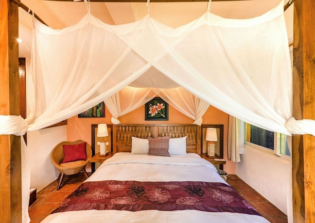 Imagen de la habitación del Hotel Red Garden Resort. Foto 8