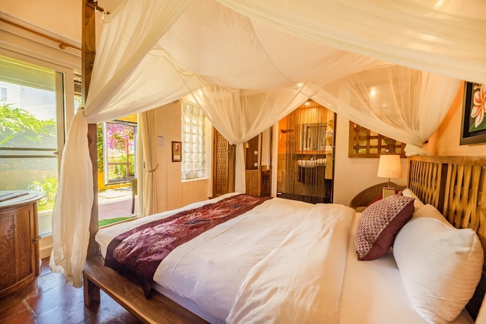 Imagen de la habitación del Hotel Red Garden Resort. Foto 11