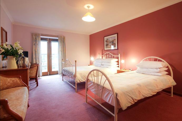Imagen de la habitación del Hotel Red House. Foto 12
