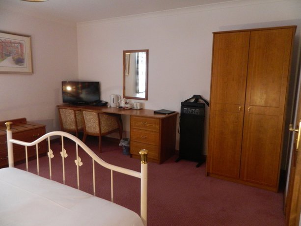 Imagen de la habitación del Hotel Red House. Foto 13
