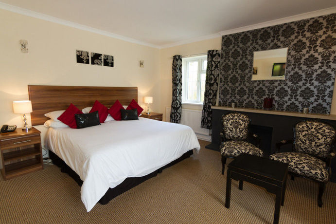 Imagen de la habitación del Hotel Red Mullions Guest House. Foto 7