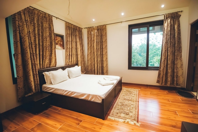 Imagen de la habitación del Hotel Red River Bungalow. Foto 11