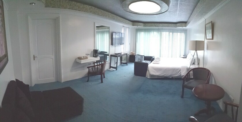 Imagen de la habitación del Hotel RedDoorz Premium at THE GRAND PENINSULA SUITES. Foto 16